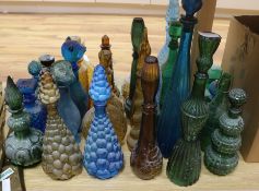 A collection of assorted coloured glass bottles