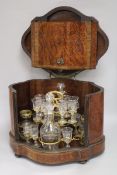 A late 19th century French serpentine cased thuyawood liqueur set (one glass deficient) height 27.