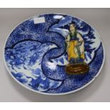 A Japanese Arita blue and white charger and a Chinese pottery figure charger diameter 40cm