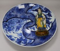 A Japanese Arita blue and white charger and a Chinese pottery figure charger diameter 40cm