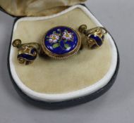 A 9ct gold and enamel floral ring and a pair of blue enamel rolled gold earclips.