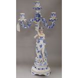 A German porcelain figural three branch candelabrum height 54cm