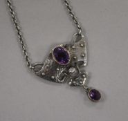 An early 20th century Arts & Crafts 950 standard white metal and amethyst set drop pendant by Murrle