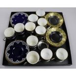 A set of five Royal Worcester coffee cans and saucers with silver can holders and one other