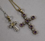 A 9ct white gold and diamond cross pendant on chain and a yellow gold and gem set cross pendant on
