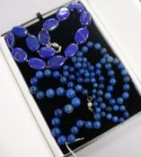 Three assorted lapis lazuli necklaces including bead and pebble.