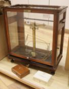 A mahogany cased set of chemist's scales 51 x 46cm