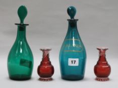 Two green glass decanters and two small pieces of glass height 23cm