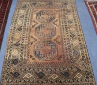 A tan ground Persian rug 190 x 125cm
