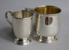 A George V silver christening mug, Chester, 1924 and a smaller modern silver christening mug, 6 oz.