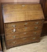 A George III oak bureau W.100cm