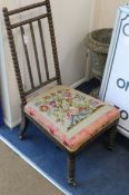A Victorian bobbin turned nursing chair with a floral tapestry seat