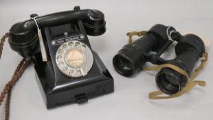 A vintage black Bakelite telephone and pair of Ross WWII Bino Prism No. 5 Mk 3x7 binoculars, with