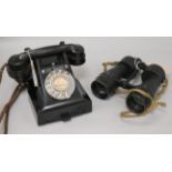 A vintage black Bakelite telephone and pair of Ross WWII Bino Prism No. 5 Mk 3x7 binoculars, with