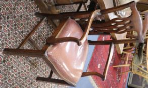 A set of seven Chippendale style dining chairs