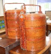 A pair of Chinese metal mounted red lacquer sectional picnic boxes W.48cm