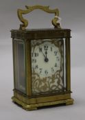 A late 19th century French brass cased eight day timepiece