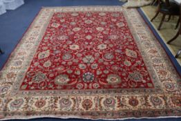 A Usak red ground carpet 380 x 300cm