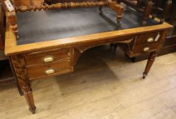 An oak writing table W.153cm