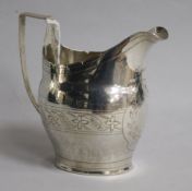 A George III engraved silver helmet shaped cream jug, marks rubbed, 3 oz.