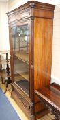 A 19th century French rosewood bookcase, enclosed by a single glazed door W.108cm