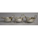 Three assorted silver sauceboats including one Edwardian, Spink & Son, London, 1909, 15.5 oz.