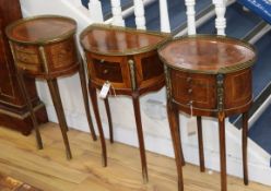 A pair of French Transitional style mahogany tables, ormolu-mounted and fitted three drawers and a