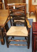 Five ladder back chairs and a carver
