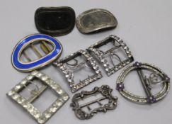 A group of antique buckles