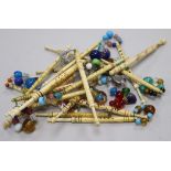 A collection of approximately twenty 19th century named bone and ivory lace bobbins