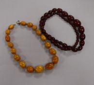 An amber bead necklace and a simulated cherry amber necklace.