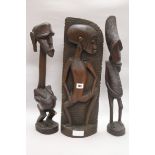 Two Makonde figures and a Papua New Guinea tribal mask tallest 53cm