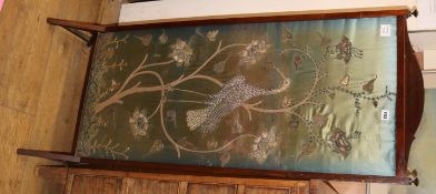 A silver threadwork panel firescreen