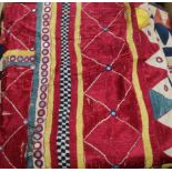 A collection of 19th century Indian silk embroidered and woven textiles