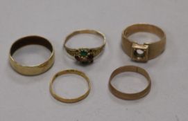 Four assorted 9ct gold rings, including and early 20th century 'suffragette' gem set ring (stones