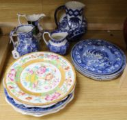 A collection of blue and white pearlware and other plates and jugs