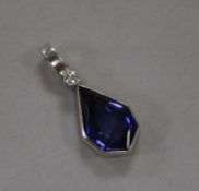 A white metal, synthetic sapphire and diamond set pendant, 20mm.