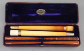 An Edwardian F. Edwards & Co of Glasshouse Street leather cased set of two gold banded meerschaum