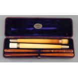 An Edwardian F. Edwards & Co of Glasshouse Street leather cased set of two gold banded meerschaum