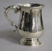 A George V silver baluster mug, Josiah Williams & Co, London, circa 1930, 10.4cm, 6 oz.