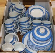 A collection of blue and white Cornish ware storage jars, a decanter, etc.