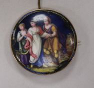 An early 20th century yellow metal framed enamelled circular brooch (a.f.), 50mm.