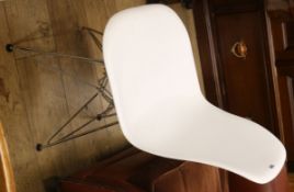 A modern chrome base chair