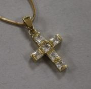 A 14ct gold and cubic zirconia set cross pendant, on a 14ct gold chain, gross 5 grams, pendant