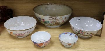 A Chinese Qianlong period famille rose punch bowl and four other Qianlong period porcelain bowls