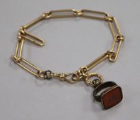 A 15ct gold chain and gilt metal and carnelian set fob. chain 27.1 grams.