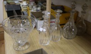 Four cut glass decanters and a cut glass vase