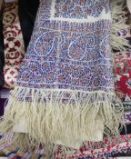 A Victorian woven silk shawl, four others and a Norwich shawl