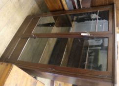 An oak glazed cabinet W.97cm
