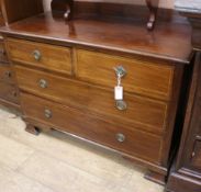 An Edwardian inlaid mahogany chest of two long and two short drawers and an inlaid mahogany dressing